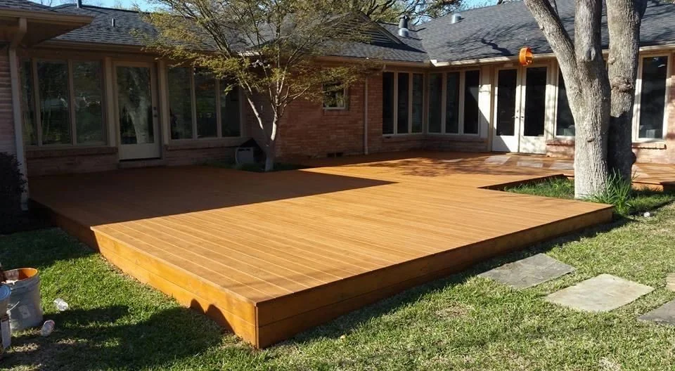 Finished wood deck built around a mature shade tree