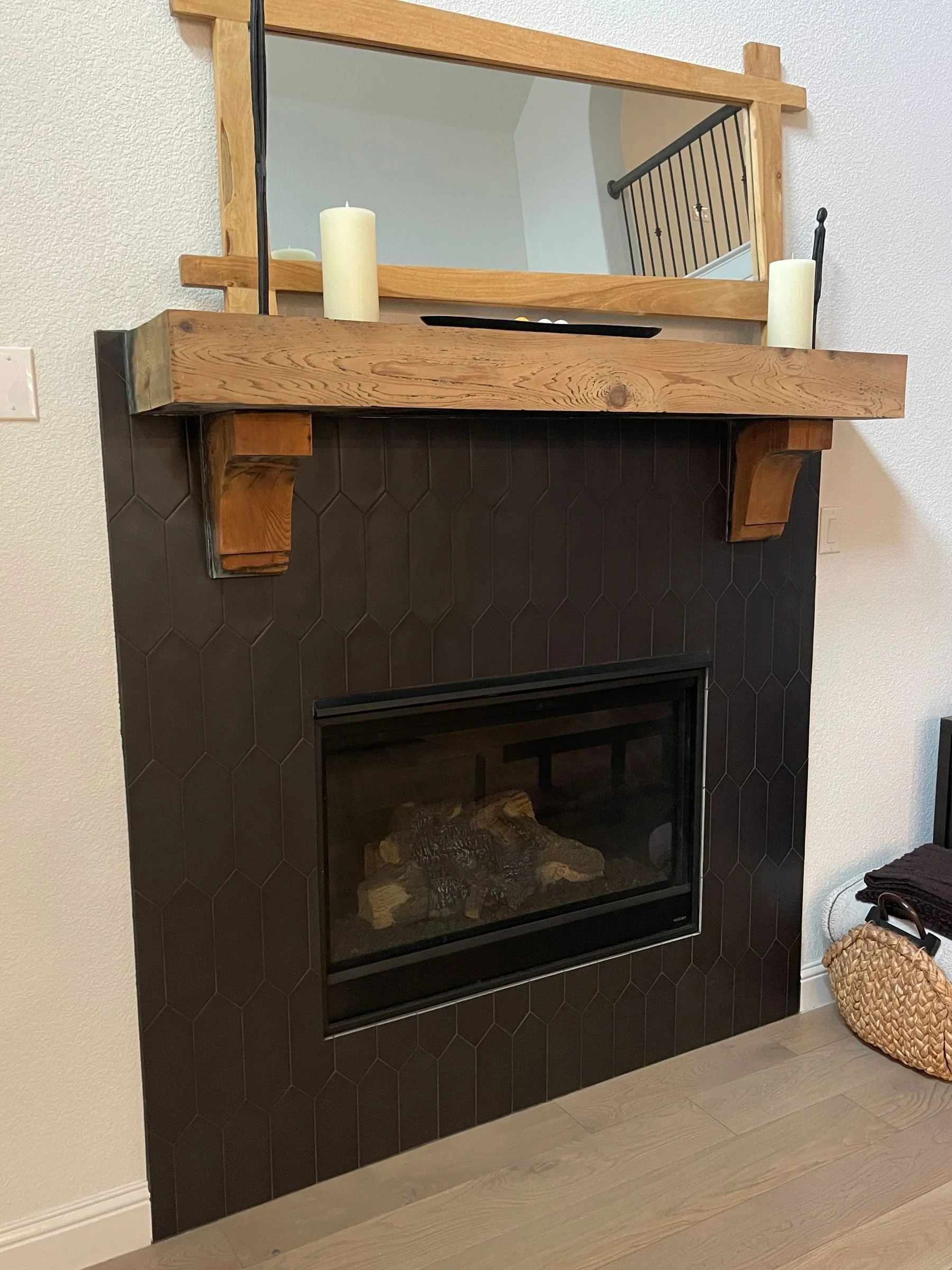 Painted fireplace surround with wood mantel detail