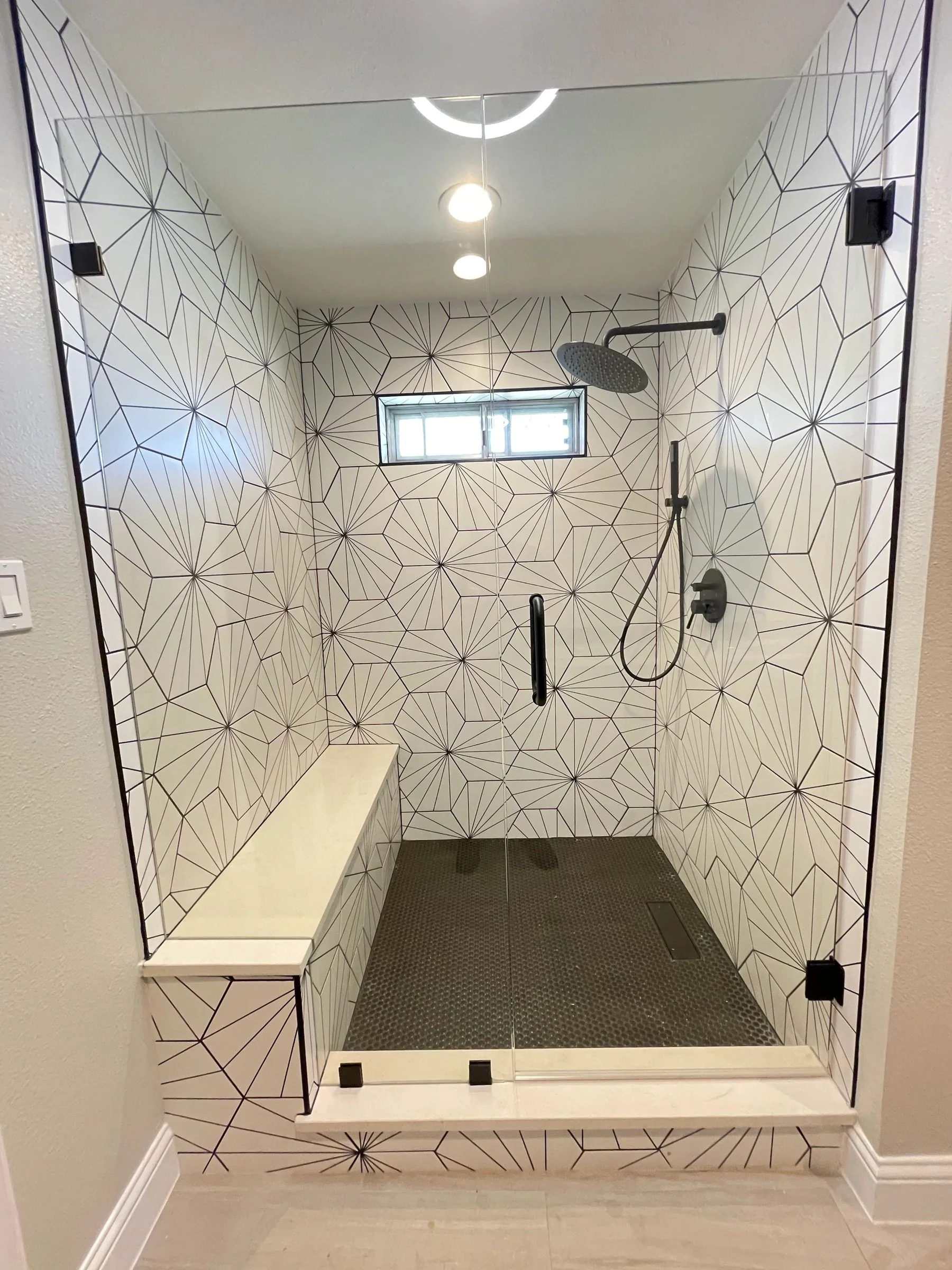 Geometric tile shower with built-in bench