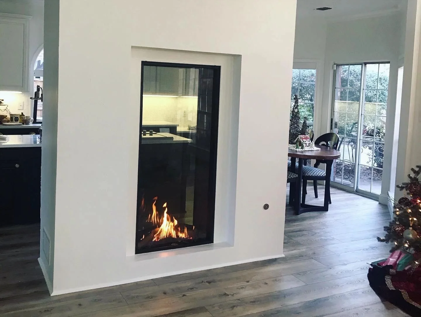 Interior repaint with a dark fireplace feature wall